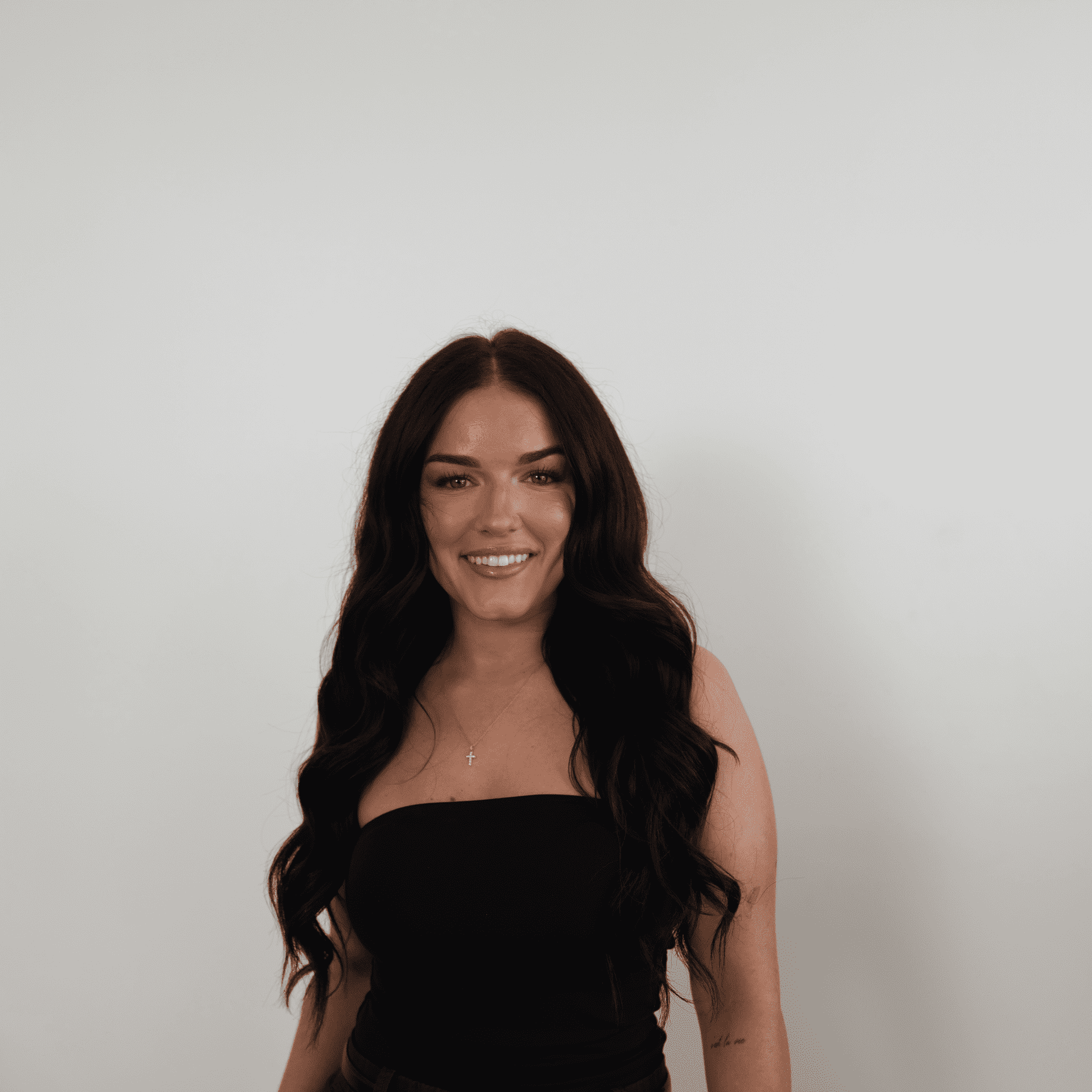 Portrait of Sammie, a professional stylist at Meraki Salon And Extensions, showcasing their expertise and style.