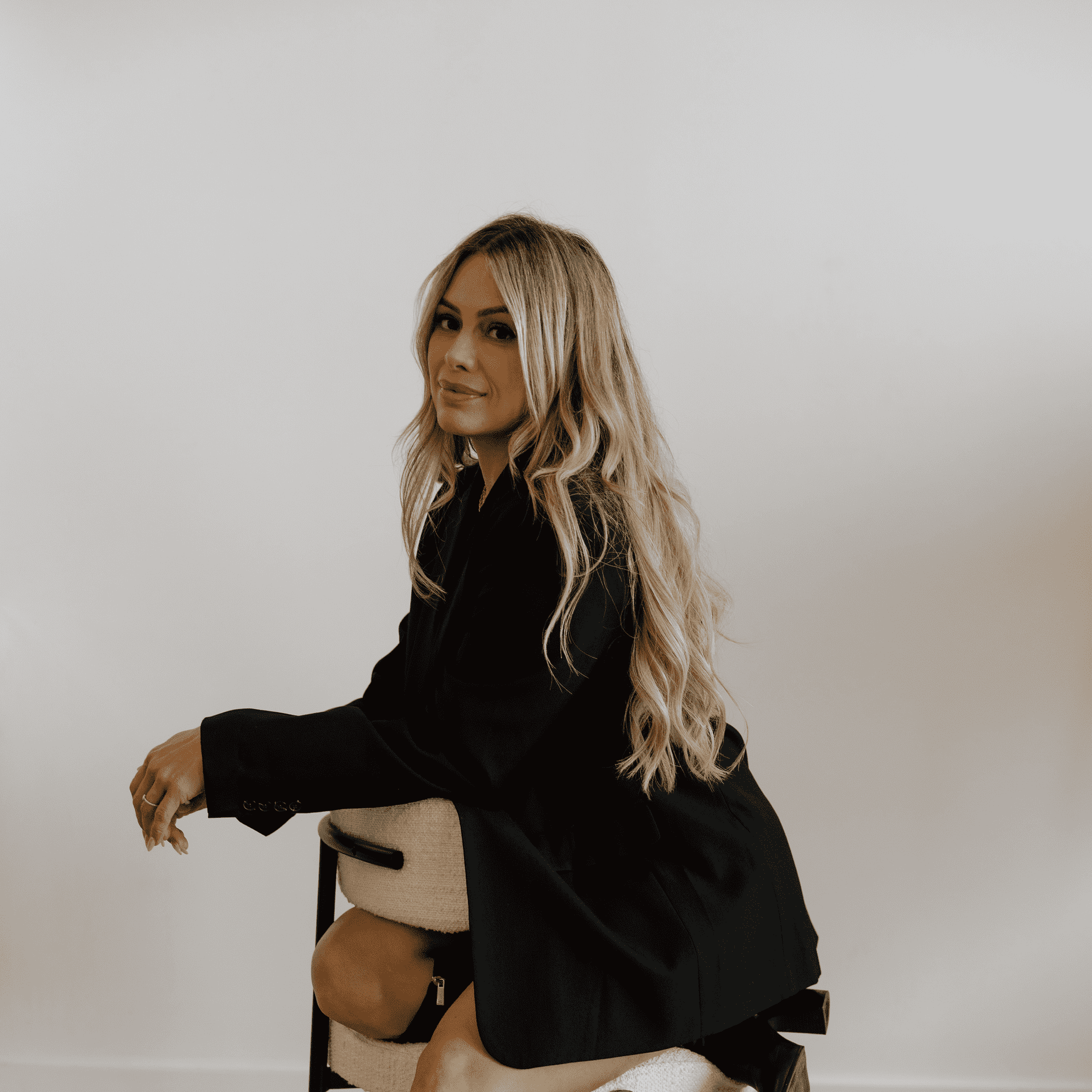 Portrait of Lydia, a professional stylist at Meraki Salon And Extensions, showcasing their expertise and style.