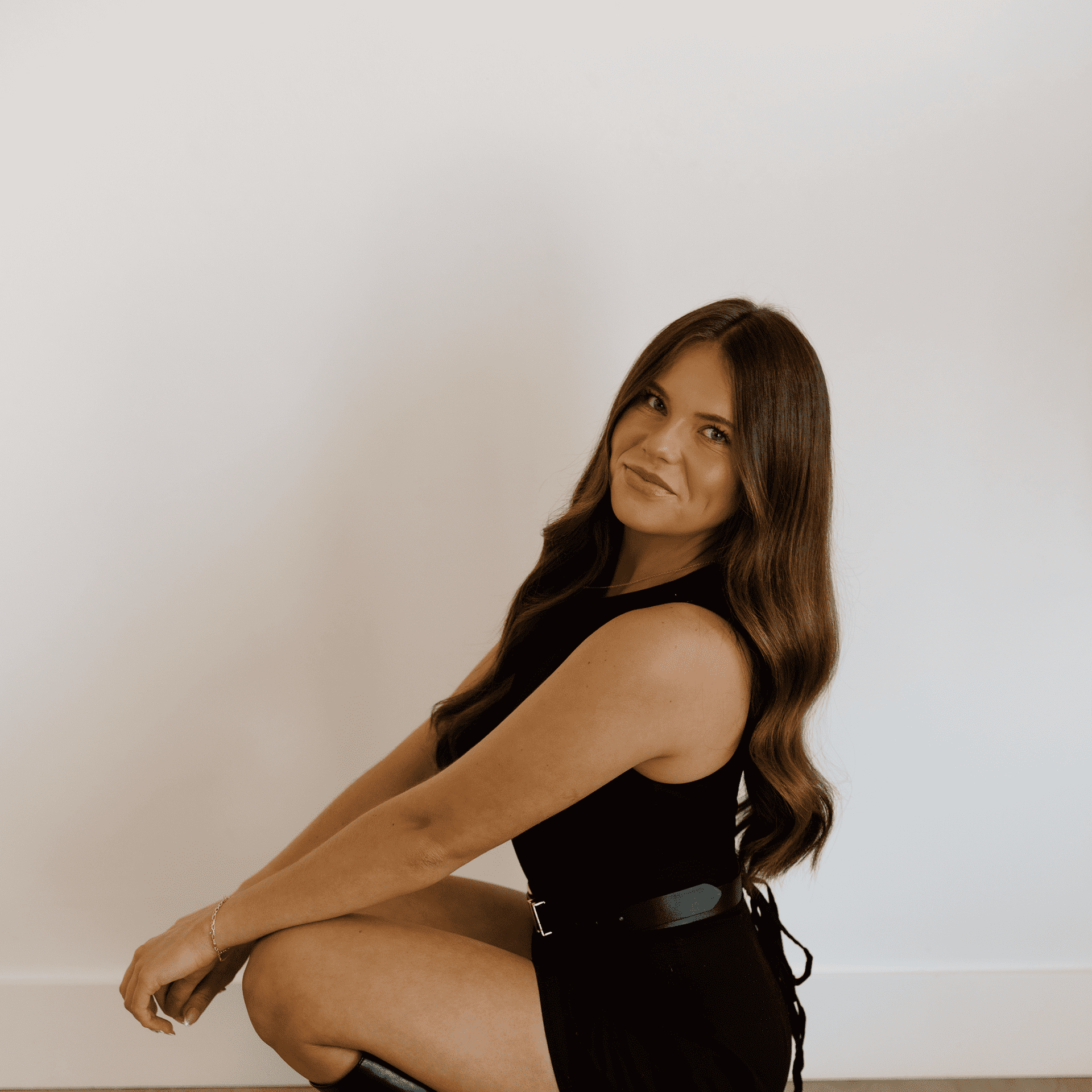 Portrait of Brittany, a professional stylist at Meraki Salon And Extensions, showcasing their expertise and style.
