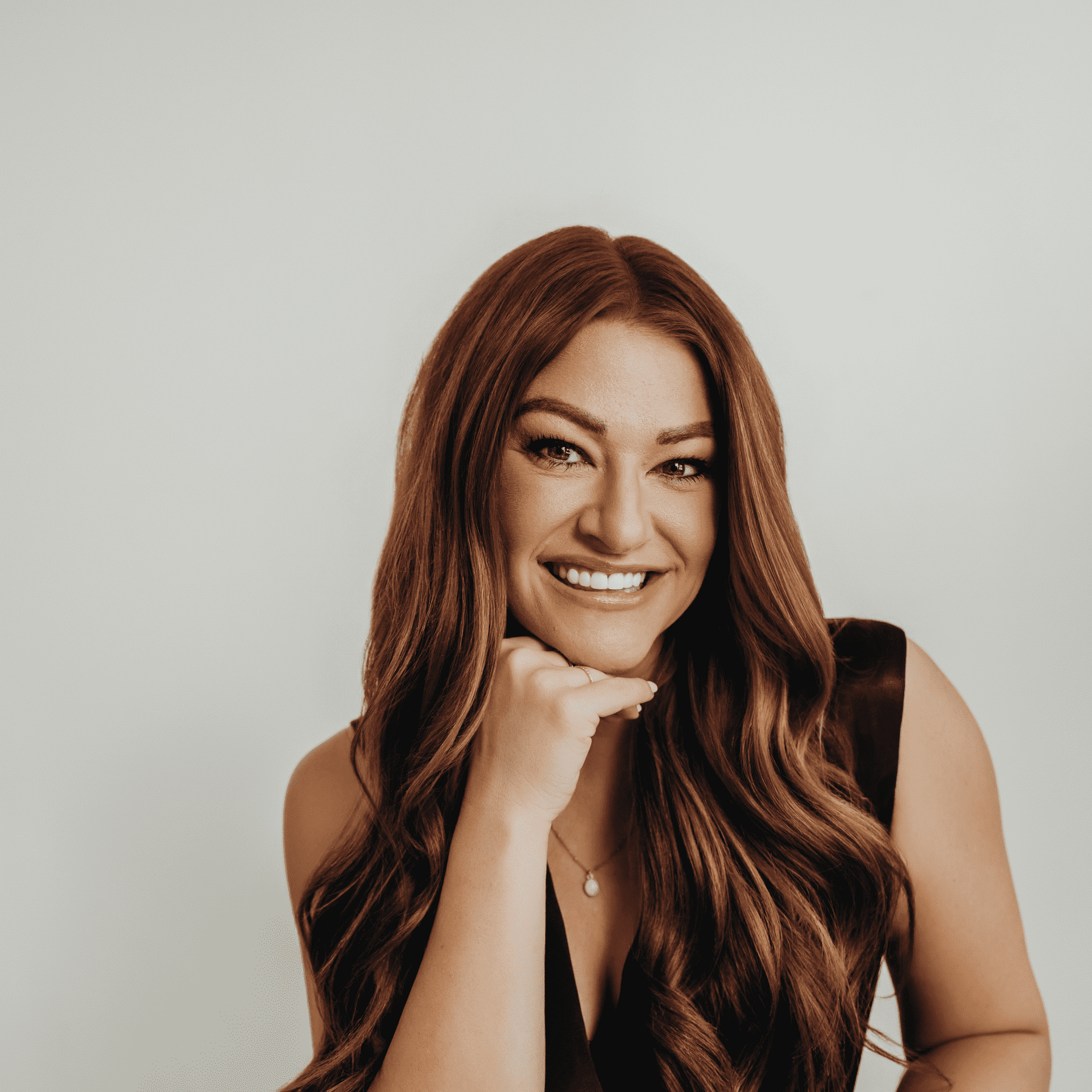 Portrait of Millie, a professional stylist at Meraki Salon And Extensions, showcasing their expertise and style.