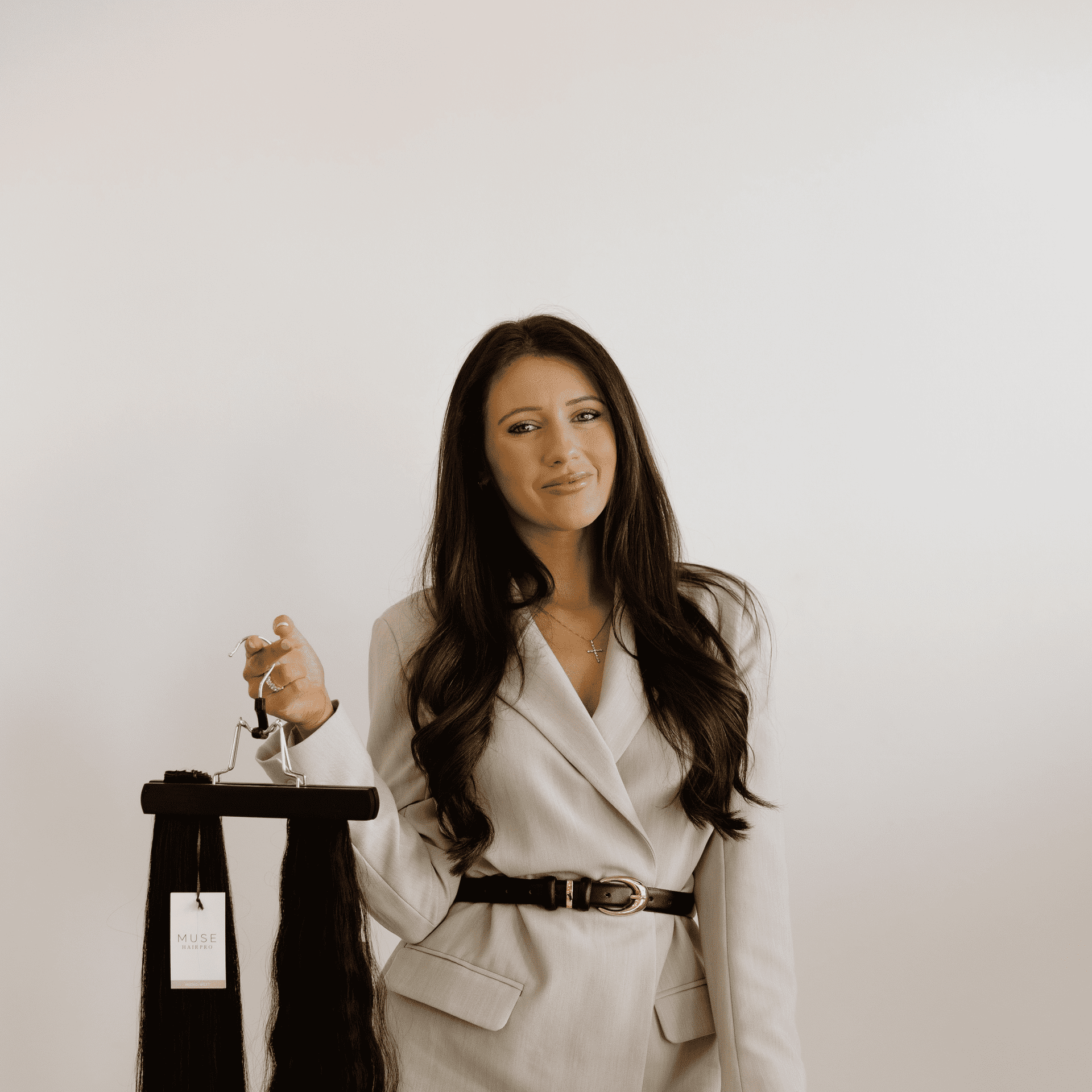 Portrait of Dominique, a professional stylist at Meraki Salon And Extensions, showcasing their expertise and style.