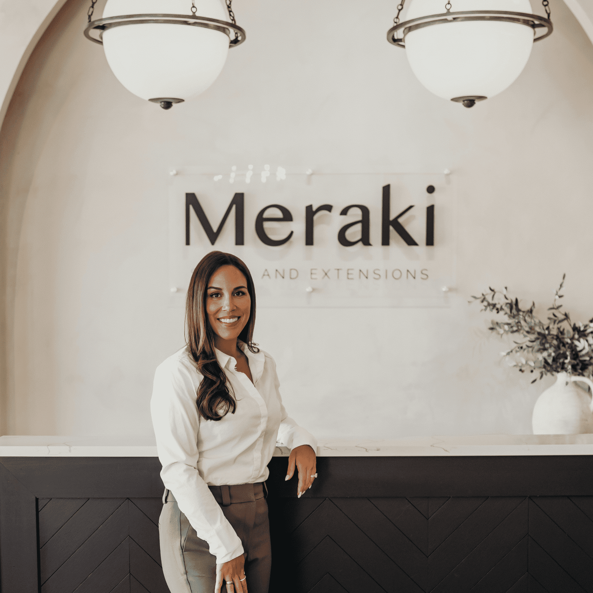 Portrait of Natasha, a professional stylist at Meraki Salon And Extensions, showcasing their expertise and style.