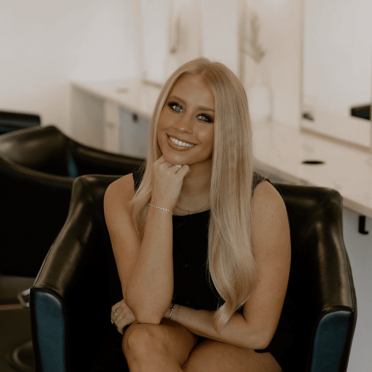 Portrait of Abbey, a professional stylist at Meraki Salon And Extensions, showcasing their expertise and style.